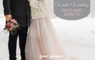 couple standing in the snow at a winter wedding